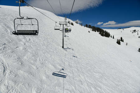 Chair lift at sunny winter day at Vail ski resort, Coloradoの写真素材
