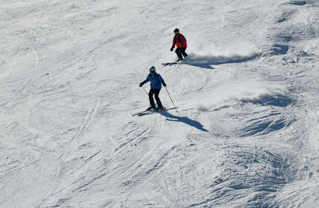 People skiing on snowy hill at Breckenridge ski resort. Extreme winter sports. Action shot. Breckenridge, COの写真素材