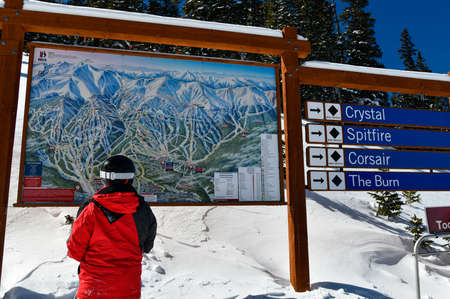 Man looking to ski trails map. Winter sports and travel. Breckenridge, COの写真素材