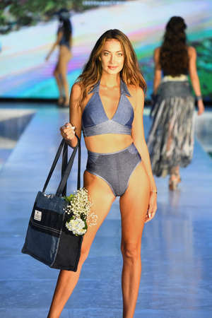 MIAMI BEACH, FLORIDA - JULY 09: A model walks the runway for Jalu Swim Show during Miami Swim Week The Shows powered by DCSW on July 09, 2021 in Miami Beach, Floridaのeditorial素材