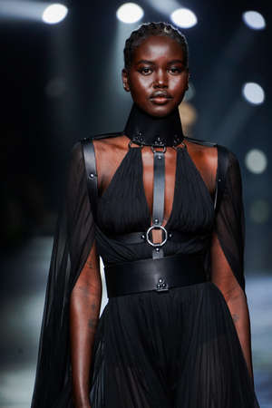 MILAN, ITALY - FEBRUARY 23: Adut Akech walks the runway at the Roberto Cavalli fashion show during...