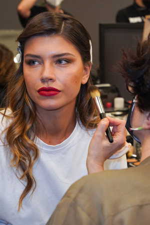 MILAN, ITALY - FEBRUARY 25: A model getting ready backstage before the Elisabetta Franchi fashion show during the Milan Fashion Week Fall/Winter 2022/2023 on February 25, 2022 in Milan, Italy.のeditorial素材