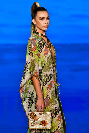 MIAMI BEACH, FLORIDA - JULY 08: A model walks the runway during the Giannina Azar show At Miami Swim...