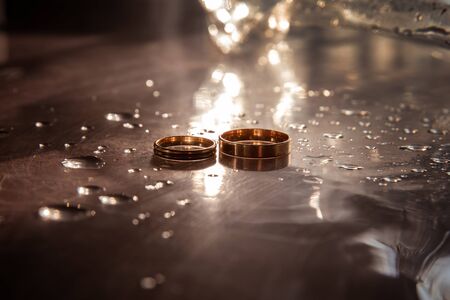 Beautiful gold background with wedding rings and starsの写真素材