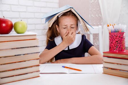 Coronavirus quarantine and distance learning. girl sneezes