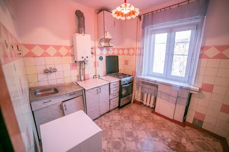 Old ugly apartment flat view from inside, interior, retro style, old kitchenの写真素材
