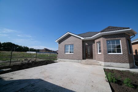Single storey house. Isolated single storey house. Front View of one floor single family house.の写真素材