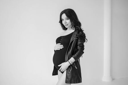 Pregnancy photo session in the style of Vogue. Black and white