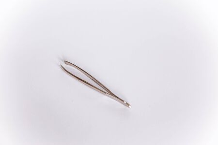 Cosmetic forceps isolated on white background. Eyebrow tongs on white backgroundの写真素材