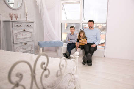 the father with children. Dad with daughter and sonの写真素材