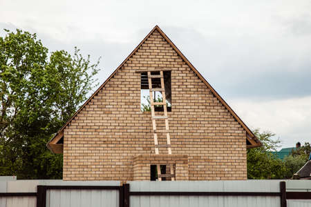 Wooden staircase to attic. staircase to the roof of the houseの写真素材