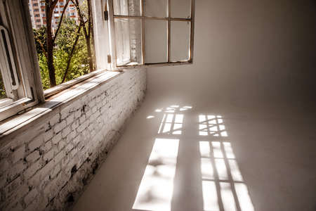 Empty open plan office. A white loft with a large open window. studio.の写真素材