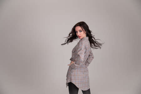 Beautiful girl student business woman on gray or white backgroundの写真素材