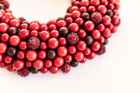 Christmas wreath on white background. red wreath circle of berries. Copy Spaceの写真素材