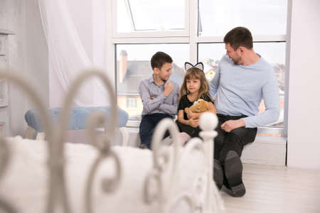 Father is surprised by the behavior of daughterの写真素材