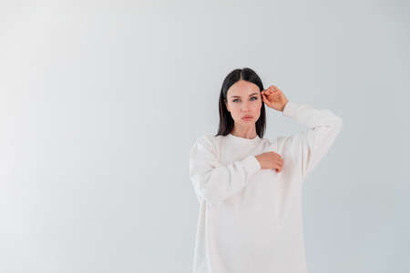 Portrait beautiful adult sports girl model on white background. hoody. soon. Copy spaceの写真素材