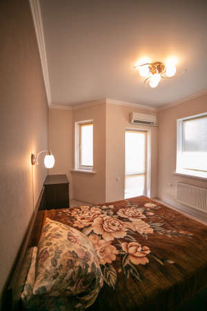 Russia, Moscow: interior room apartment. standard repair decoration in hostel. old not modern decor. room bedroom.の写真素材