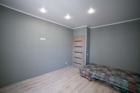 Concrete floor texture. the room in the apartment is in gray. gray wallpaper on wallの写真素材
