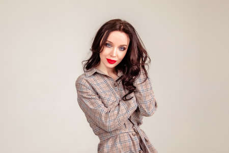 young woman closeup portrait. beautiful brunette girl with red lipsの写真素材