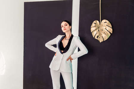 Portrait of elegantly young gorgeous brunette woman. portrait of a sexy beautiful brunette in a jacket. Toned. copyspaceの写真素材