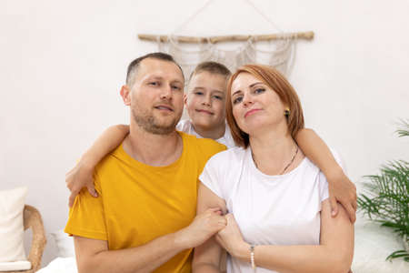 mother and father with a son. boy with parents. the concept of the familyの写真素材