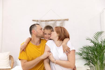 mother and father with a son. boy with parents. the concept of the familyの写真素材