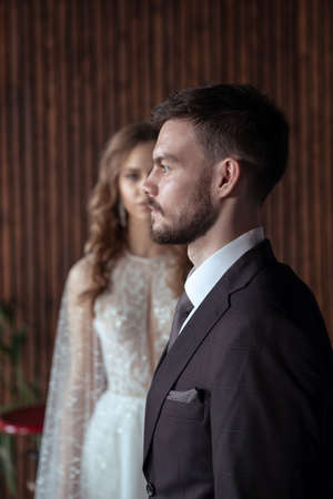 young groom and bride. stylish pair in a beautiful loft interiorの写真素材