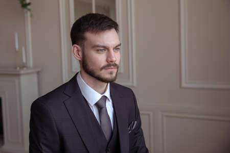 portrait of a brutal young man with a beard. business. successの写真素材