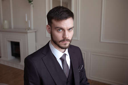 portrait of a brutal young man with a beard. business. successの写真素材