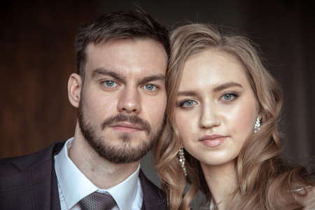 a large portrait of a man and a woman. portrait of the groom and brideの写真素材