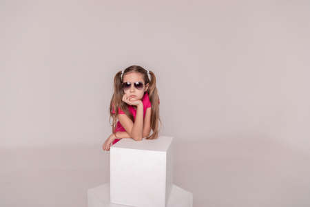beautiful girl in sunglasses. advertising children's glasses. copy spaceの写真素材