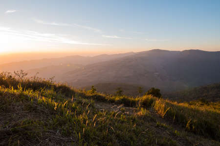 Sun in the moring paint the mountain with light.の写真素材