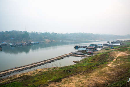 Old raft community at Mon Bridge and fog in the morning.の写真素材