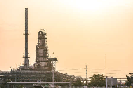 Chimney and smokestack part of oil refinery.