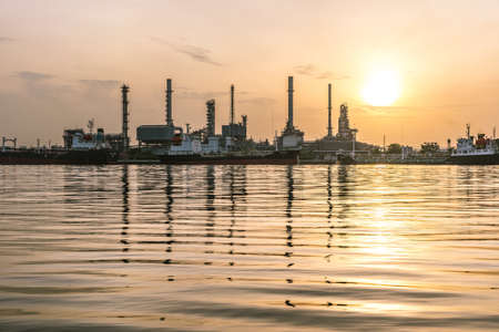 Hard tone of oil refinery over the river.の写真素材