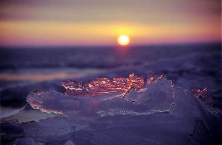 Ice floe and sun on winter Baikal lakeの写真素材