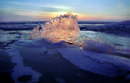 Ice floe and sun on winter Baikal lakeの写真素材