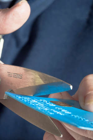 Woman cutting up credt cardの写真素材