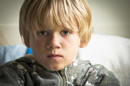 Boy with sad eyesの写真素材