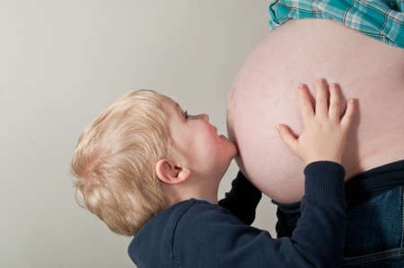 Pregnant woman with her sonの写真素材