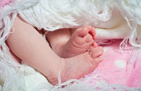 Newborn baby tiny feet and toesの写真素材