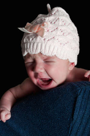 Upset newborn babyの写真素材