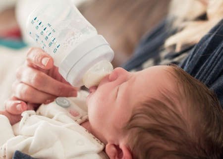 Bottle feeding a baby