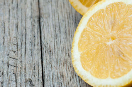 Freshly cut lemons with copy space to the left of imageの写真素材