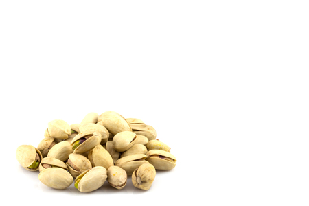 pistachios isolated on white backgroundの写真素材