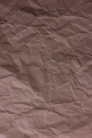 Brown crumpled paper background textureの写真素材