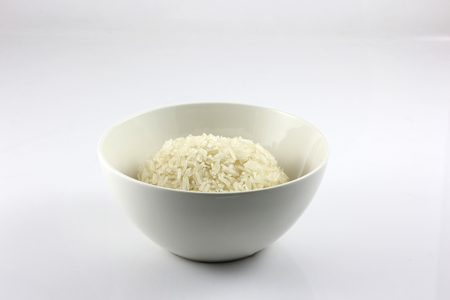 asian sticky rice in a bowl on a white backgroundの写真素材