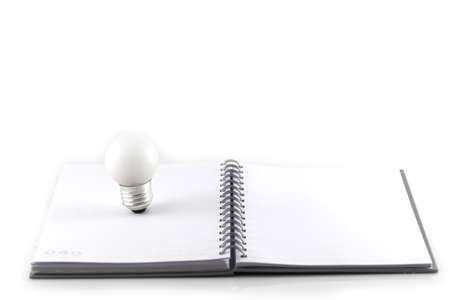 Notebook and bulbs isolate on white backgroundの写真素材