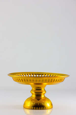 golden ware isolate in white backgroundの写真素材