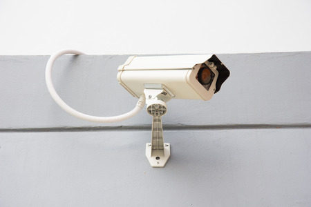 CCTV security camera on the front of buildingの写真素材